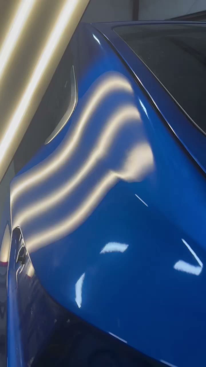 Blue fender after repair with clean reflections