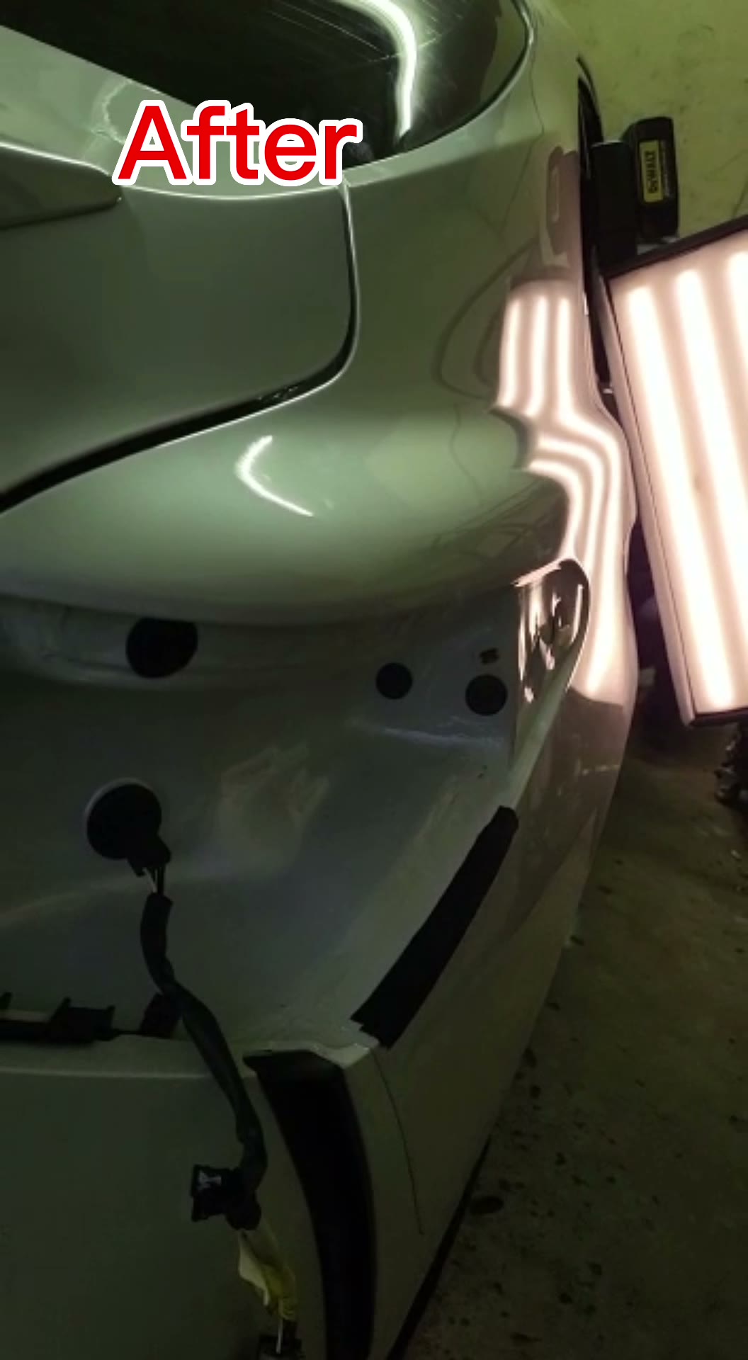 Gray quarter panel after paintless dent repair