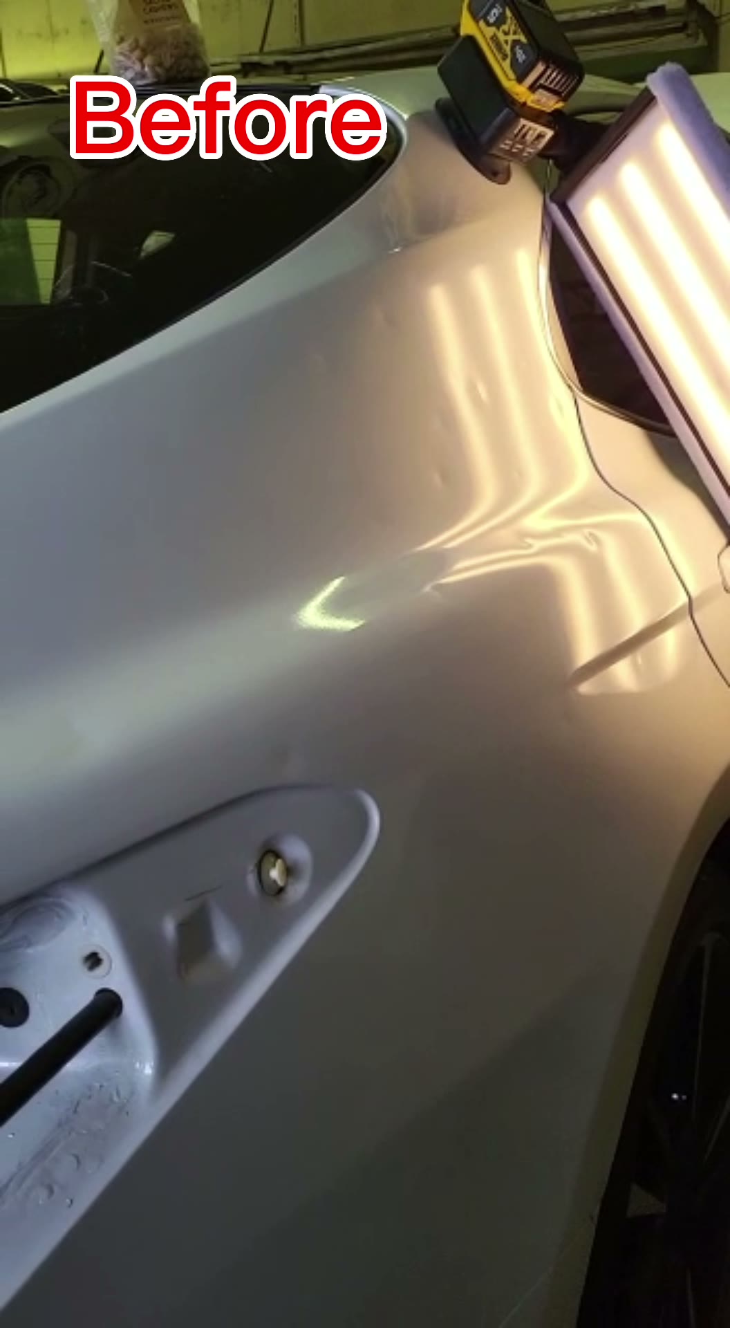 Gray quarter panel with hail damage